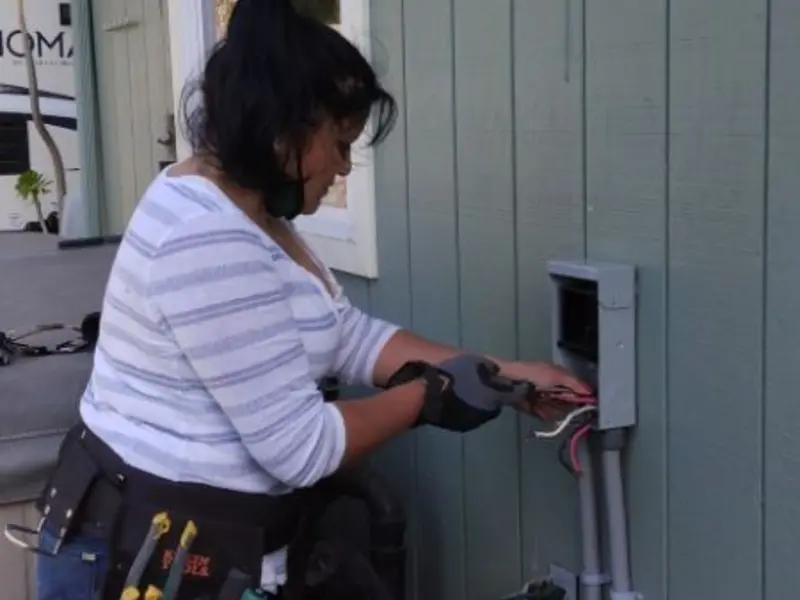 Licensed electrician wiring an exterior subpanel in Seagoville